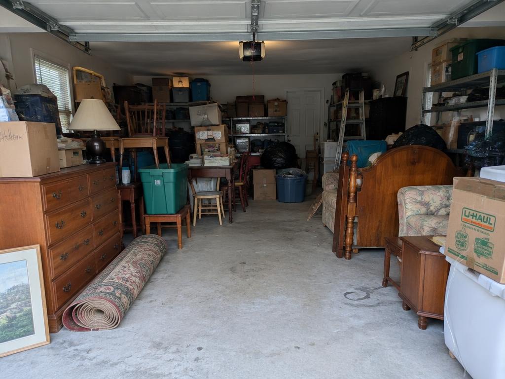 Garage packed with old furniture and boxes
